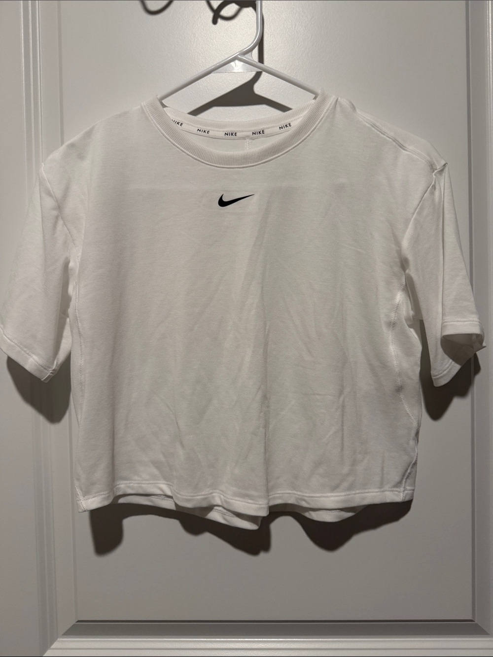 Nike White Short Sleeve Tee with Black Swoosh Center Chest